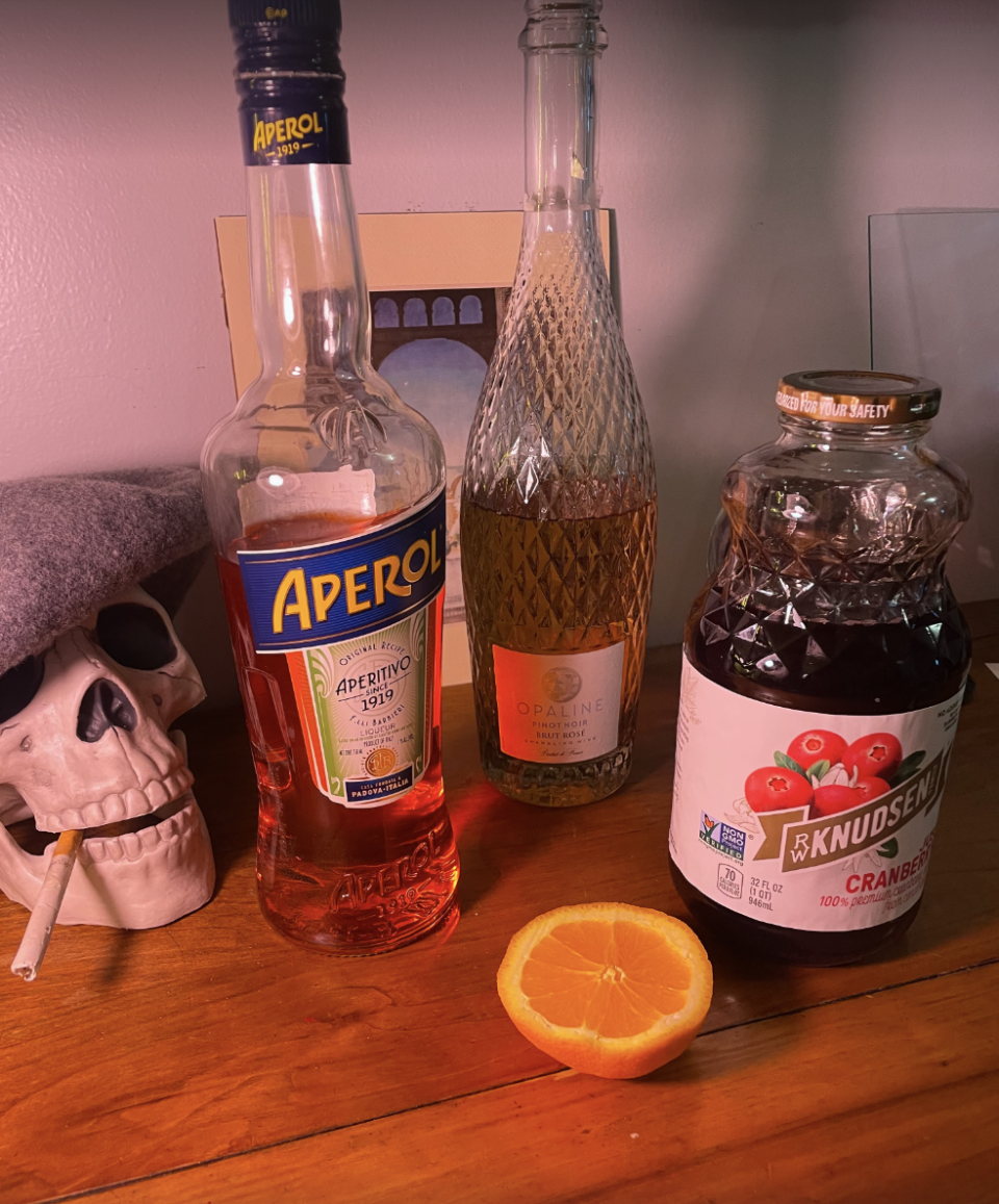 - 3 ounces Aperol - 3 ounces cranberry juice (I like things bitter, so I used actual cranberry juice, but you can use cranberry juice cocktail) - juice of 1/2 of an orange- 5 ounces Prosecco - rosemary sprig for garnish