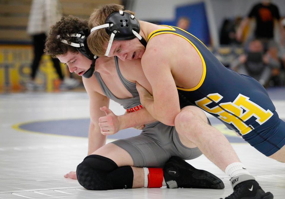 Zachary LaPlante of Siena Heights tries to control Indiana Tech's Michael Tharpe Thursday night.