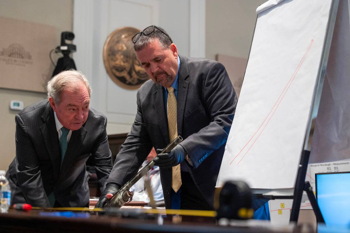Defense attorney Dick Harpootlian and Kenneth Kinsey estimate the distance of a shotgun during Paul Murdaugh’s murder during Alex Murdaugh’s trial for murder at the Colleton County Courthouse on Thursday, Feb. 16, 2023. Joshua Boucher/The State/Pool