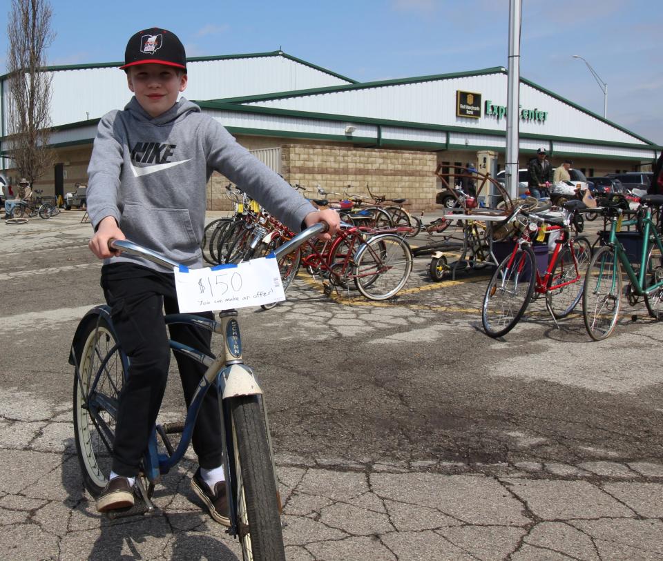 Eleven-year-old Sid Balogh of Akron, Ohio pedaled around the fairgrounds with a handwritten sign advertising that his bike was for sale.