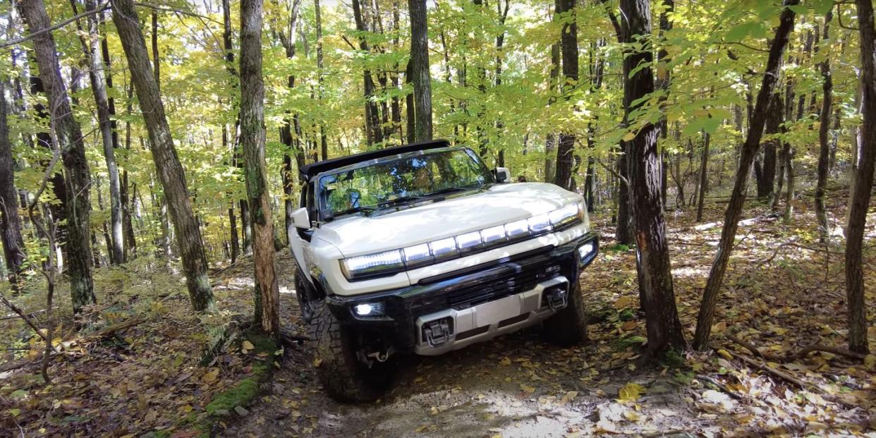 gmc hummer ev offroad on narrow trails