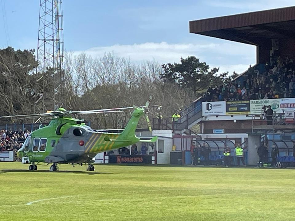 An air ambulance lands on the pitch at the Bob Lucas Stadium  (@lozherdman)