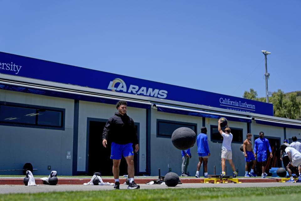 The Los Angeles Rams stretch during an NFL football practice Tuesday, June 11, 2024, in Thousand Oaks, Calif. (AP Photo/Ryan Sun)