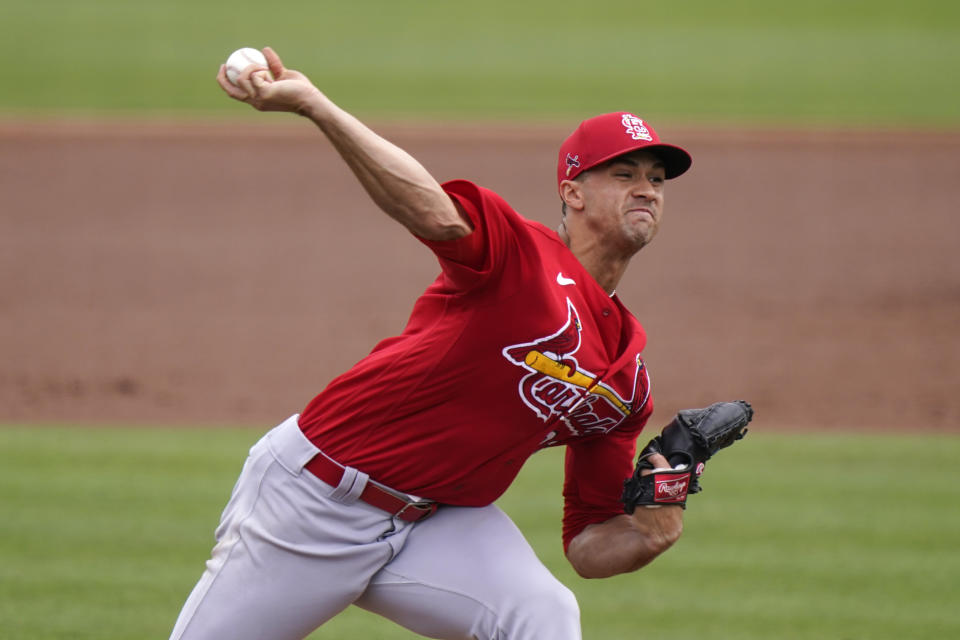 FILE - St. Louis Cardinals starting pitcher Jack Flaherty throws during the second inning of a spring training baseball game against the Miami Marlins in Jupiter, Fla., in this Monday, March 22, 2021, file photo. Lucas Giolito, Max Fried and Jack Flaherty were teammates nine years ago at Harvard-Westlake, a prestigious prep school in Los Angeles. On Thursday, April 1, all three will be opening day starting pitchers in the major leagues.(AP Photo/Lynne Sladky, File)