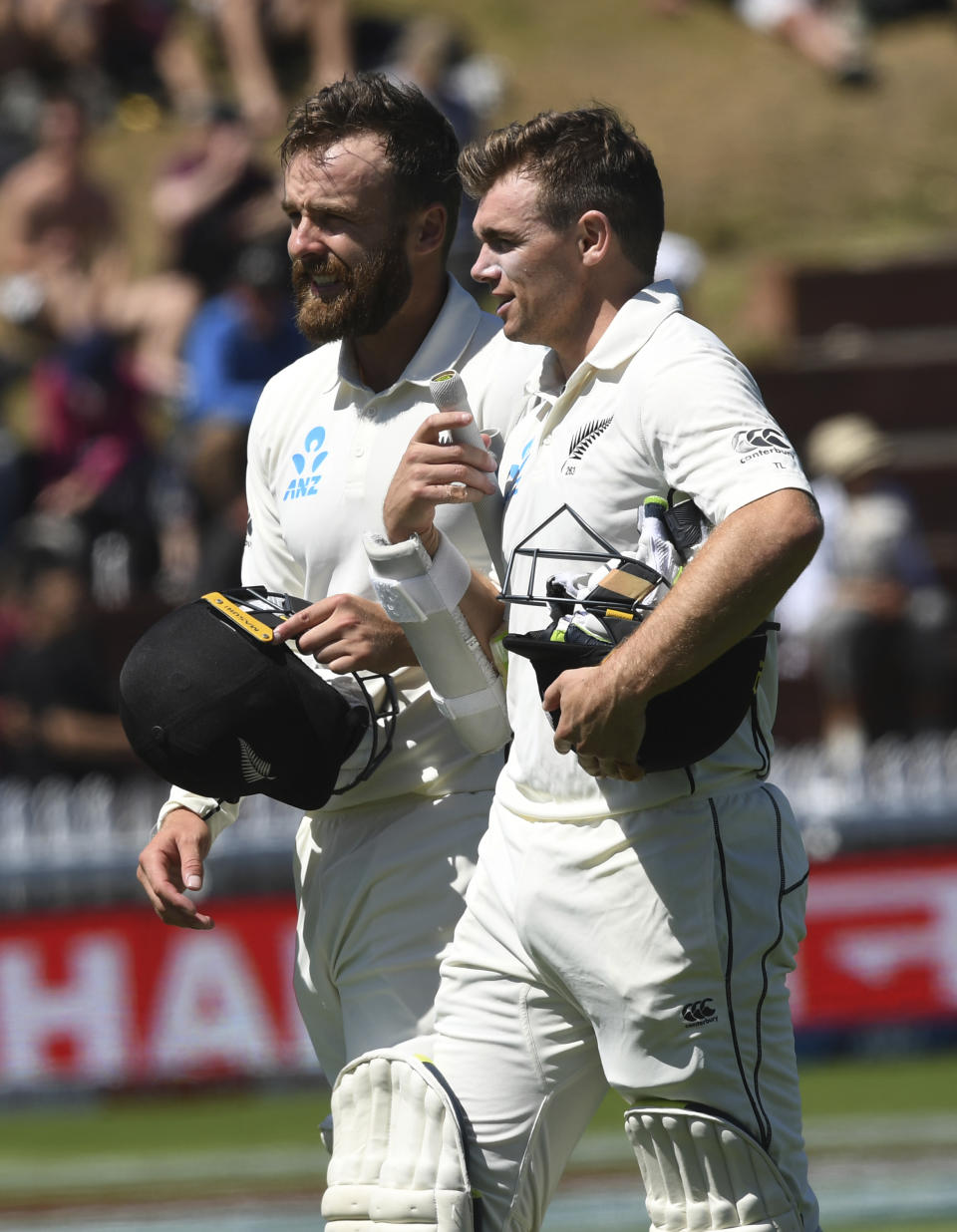 New Zealand's Tom Blundell, left and Tom Latham walk off as New Zealand defeat India by ten wickets during the first cricket test between India and New Zealand at the Basin Reserve in Wellington, New Zealand, Monday, Feb. 24, 2020. (AP Photo/Ross Setford)