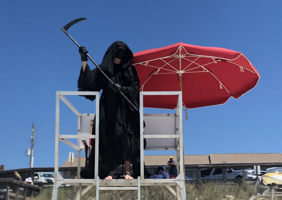 A Florida attorney is touring re-opened beaches as the Grim Reaper. (Photo: Twitter)