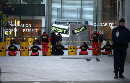 Greenpeace activists block the entrance of the France's state-owned electricity company EDF headquarters to protest against nuclear energy safety in Paris, France, December 14, 2016. REUTERS/Jacky Naegelen