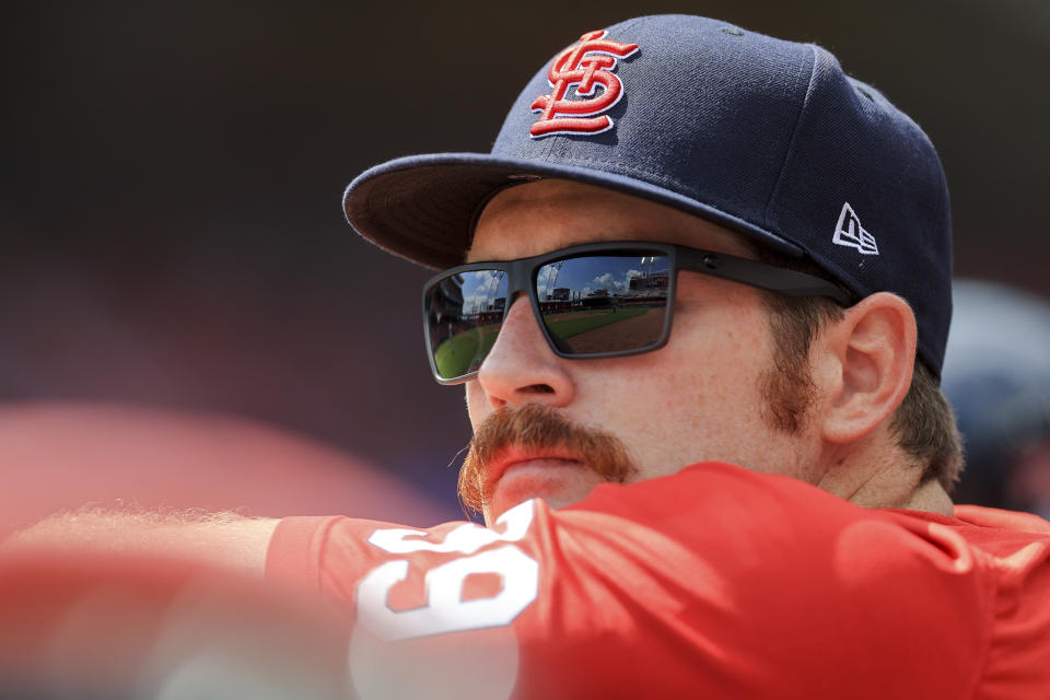 St. Louis Cardinals' Miles Mikolas watches from the dugout during the fourth inning of the first game of a doubleheader baseball game against the Cincinnati Reds in Cincinnati, Wednesday, Sept. 1, 2021. (AP Photo/Aaron Doster)