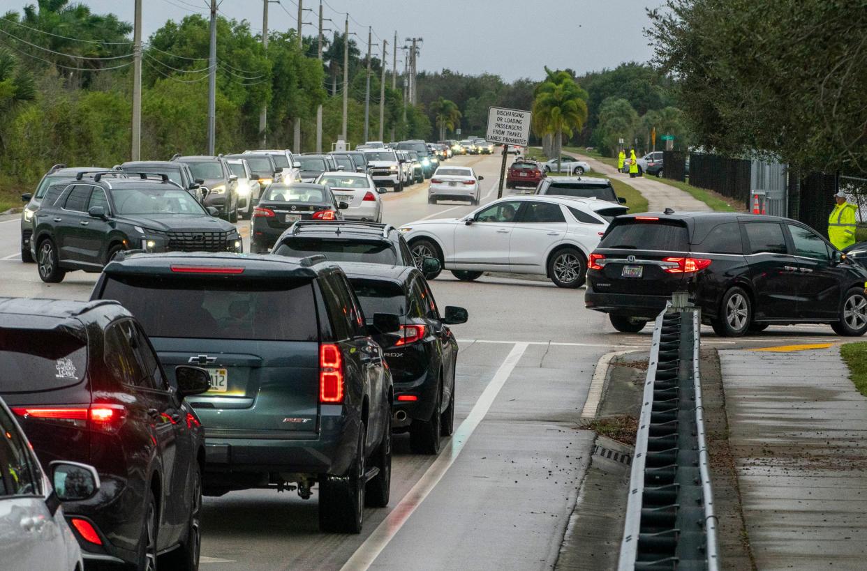 Cars line up along Acme Dairy Road to drop students off at Sunset Palms Elementary School west of Boynton Beach, Florida on November 15, 2023.