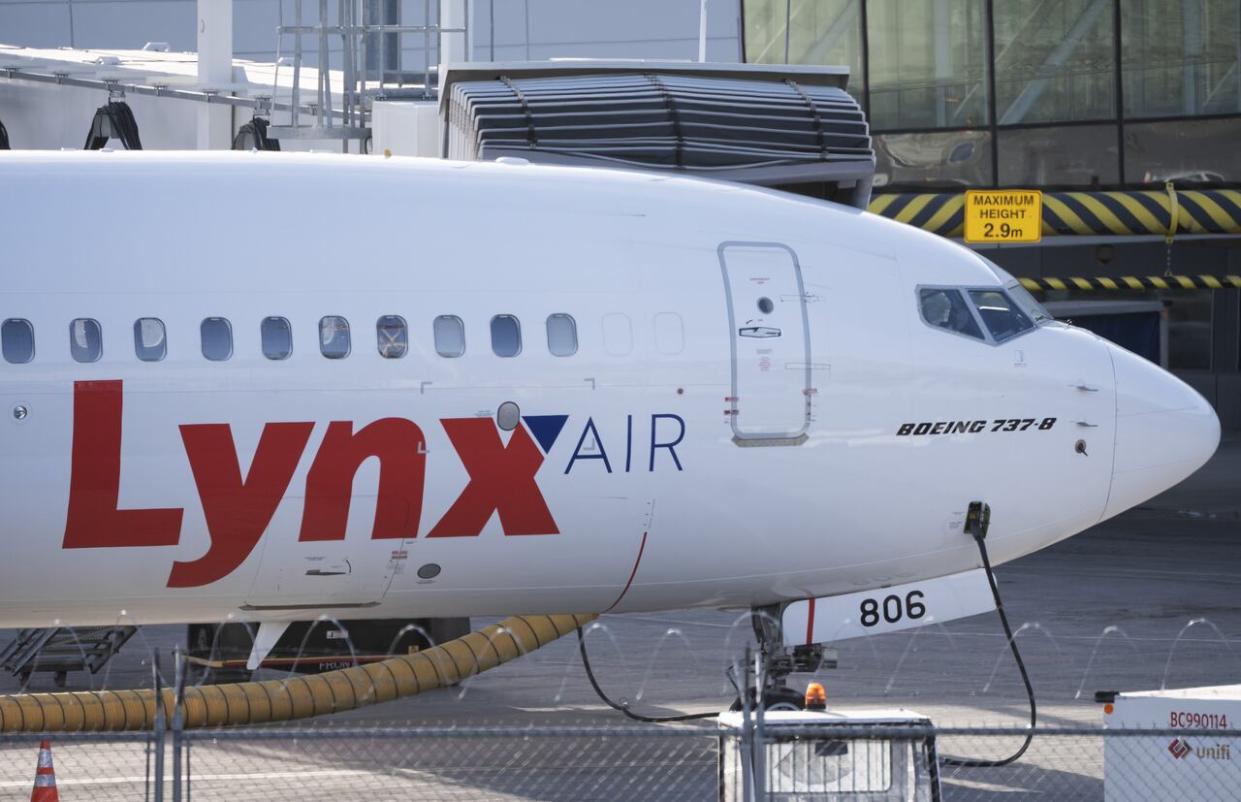 A Lynx Air Boeing 737 jet sits at a gate at the international airport in Calgary on Feb. 23, 2024. Officials with the Calgary-based company announced Thursday evening that it is ceasing operations, effective at 12:01 a.m. MT on Feb. 26, 2024, after filing for creditor protection. (Todd Korol/The Canadian Press - image credit)