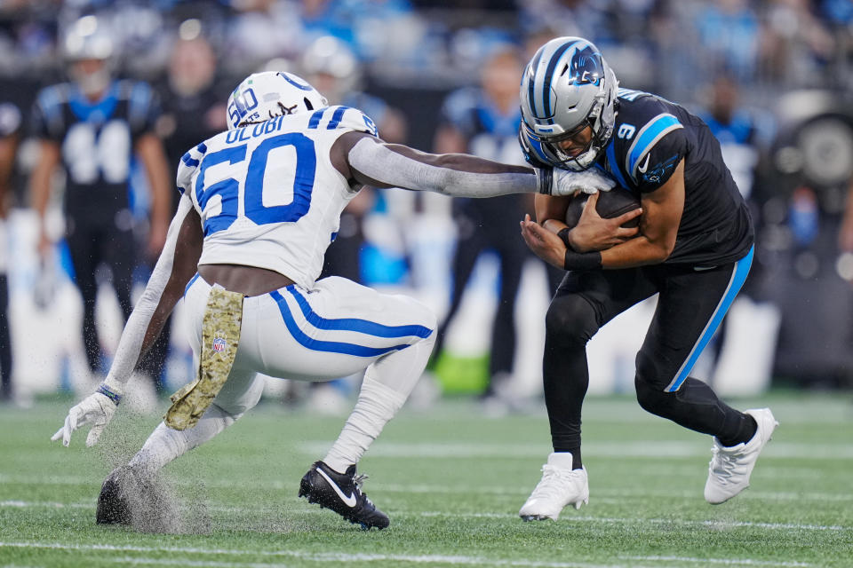 Carolina Panthers quarterback Bryce Young is tackled by Indianapolis Colts linebacker Segun Olubi during the first half of an NFL football game Sunday, Nov. 5, 2023, in Charlotte, N.C. (AP Photo/Rusty Jones)