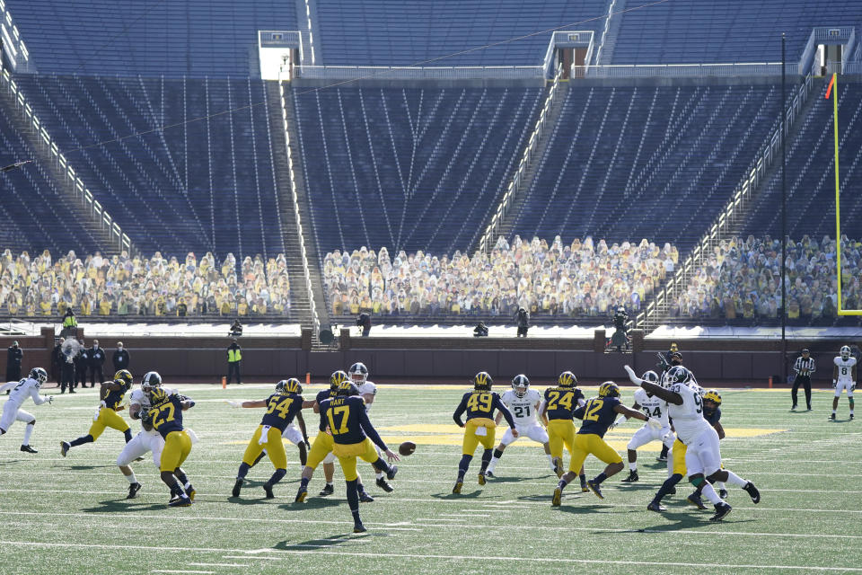 Michigan punter Will Hart (17) kicks to Michigan State during the first half of an NCAA college football game, Saturday, Oct. 31, 2020, in Ann Arbor, Mich. (AP Photo/Carlos Osorio)