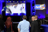 People watch the IIHF Ice Hockey World Championships final match between Canada and Finland during the European Parliament elections in Helsinki, Finland May 26, 2019. Lehtikuva/Vesa Moilanen/via REUTERS