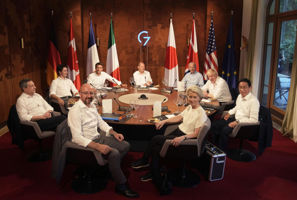 Group of Seven leaders gather for a dinner event at Castle Elmau in Kruen, near Garmisch-Partenkirchen, Germany, on Sunday, June 26, 2022. The Group of Seven leading economic powers are meeting in Germany for their annual gathering Sunday through Tuesday. Leaders clockwise from front left, European Council President Charles Michel, Italy's Prime Minister Mario Draghi, Canada's Prime Minister Justin Trudeau, French President Emmanuel Macron, German Chancellor Olaf Scholz, U.S. President Joe Biden, British Prime Minister Boris Johnson, Japan's Prime Minister Fumio Kishida and European Commission President Ursula von der Leyen. (AP Photo/Markus Schreiber, Pool)