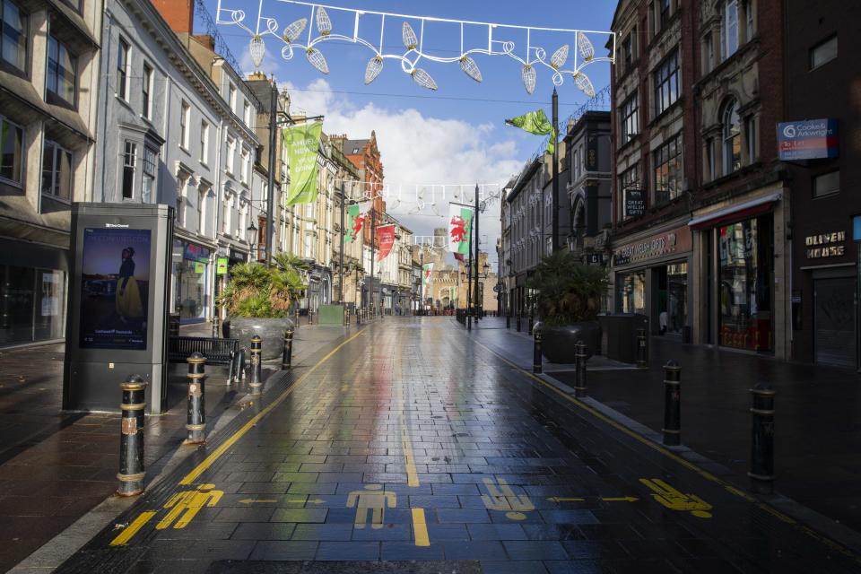 CARDIFF, WALES, UNITED KINGDOM - OCTOBER 30, 2020 - The empty high street of Cardiff City centre at the start of the second week of the two-week firebreak lockdown to slow the spread of coronavirus. The First Minister has announced that at the end of the lockdown on November 9th, two families will be allowed to form a bubble and there will be no travel restrictions within Wales.  - PHOTOGRAPH BY Mark Hawkins / Barcroft Studios / Future Publishing (Photo credit should read Mark Hawkins/Barcroft Media via Getty Images)