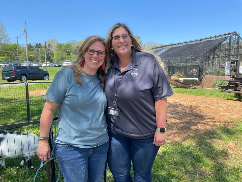 Horticulture teacher Val Elton and animal science teacher Taylor Watson oversee the annual Future Farmers of America plant sale at Farragut High School on April 15.