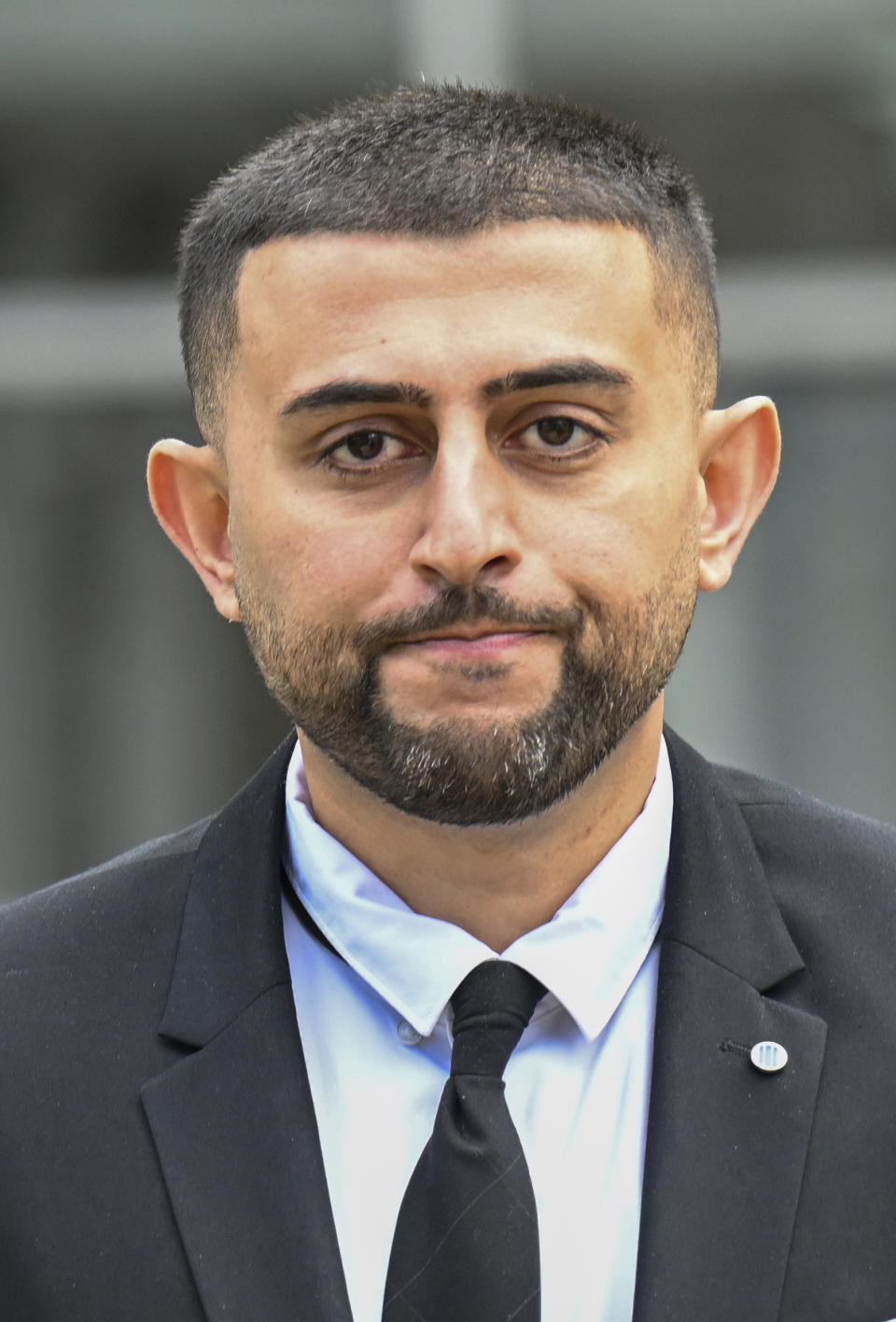 Nauman Hussain, who ran the limousine company involved in the 2018 crash that killed 20 people, walks outside during a lunch break in a new trial in Schoharie, N.Y., on Monday, May 1, 2023. Judge Peter Lynch, rejected a plea agreement for Hussain to avoid prison time. (AP Photo/Hans Pennink)