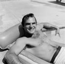 <p>The actor lounges on a pool float, while at Dick Clark's house for a party in 1960. </p>
