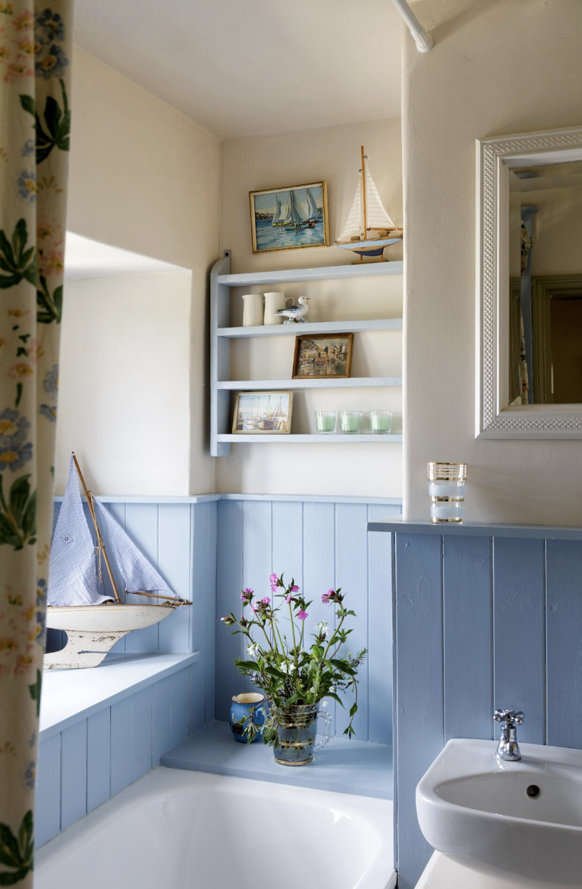 bathroom shelf ideas, blue and cream colored bathroom with shelving on the wall