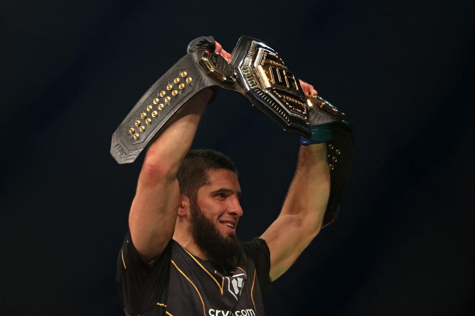 Islam Makhachev reacts after defeating Charles Oliveira in the lightweight championship at the Ultimate Fighting Championship (UFC) event at the Etihad Arena in Abu Dhabi on October 22, 2022. (Photo by Giuseppe CACACE / AFP) (Photo by GIUSEPPE CACACE/AFP via Getty Images)