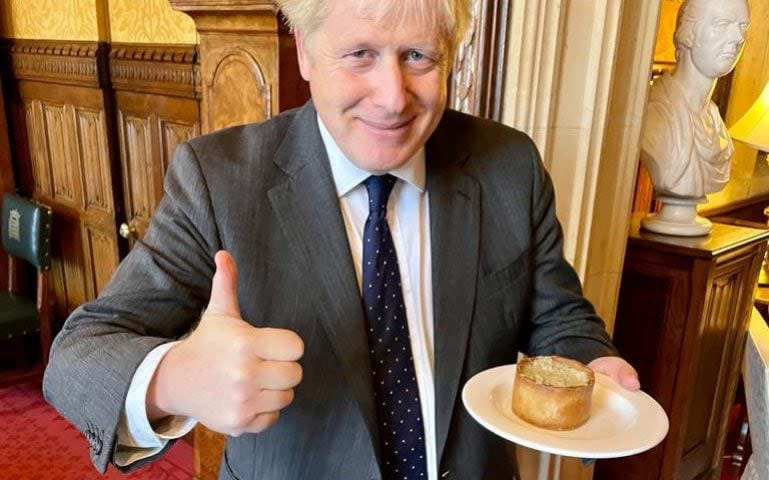 Boris Johnson posing up with a pork pie from Alicia Kearns in September 2021 for British Food Fortnight - Alicia Kearns/Twitter