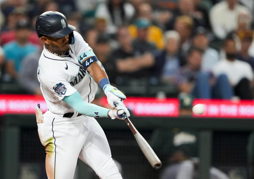 The Seattle Mariners' Julio Rodriguez hits a two-run home run in the fourth inning Monday against the Oakland Athletics. (AP Photo/Lindsey Wasson)