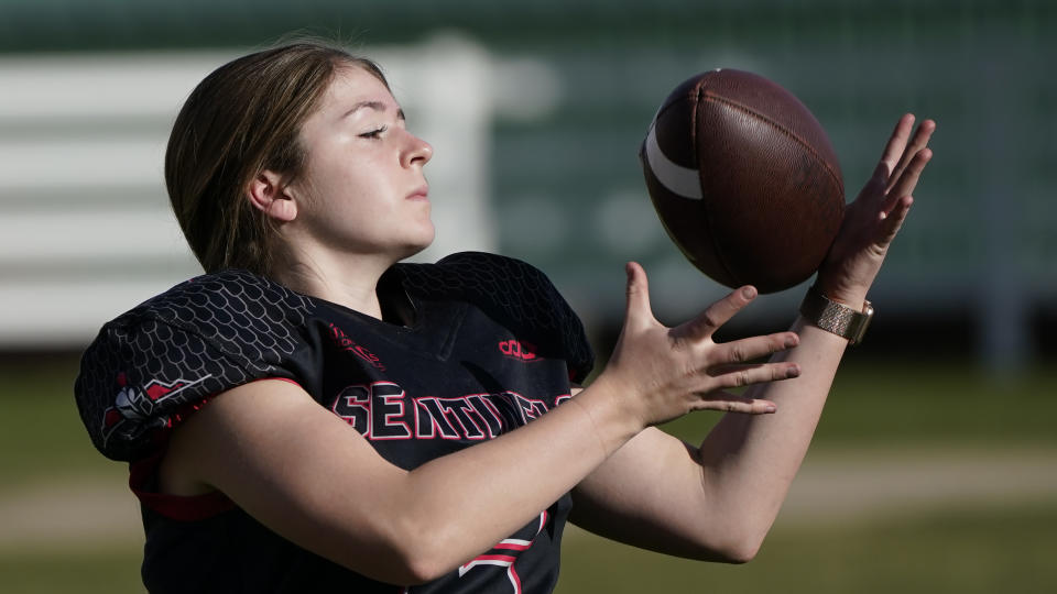 FILE - Sam Gordon catches a football in Herriman, Utah, in this Oct. 20, 2020, file photo. A federal judge ruled against Gordon on Monday, March 1, 2021, finding that Utah school districts don't have to offer separate football teams for girls. (AP Photo/Rick Bowmer, File)