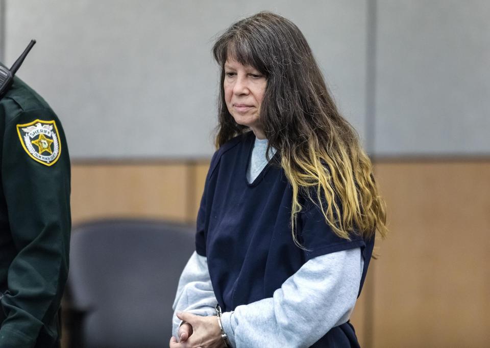 Sheila Keen-Warren, accused of dressing as a clown and fatally shooting her lover's wife in 1990, enters court ahead of her first-degree murder trial.