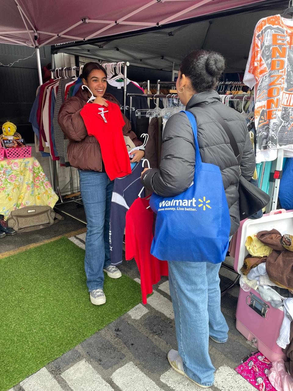 The only thing better than shopping secondhand by yourself is having a friend with you to pass judgment. These women are enjoying the Knoxville Vintage Market.