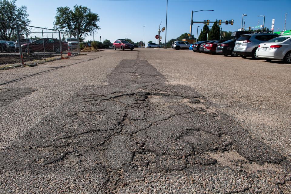 A rough patch awaits drivers at the MAX line parking northeast of the intersection of Drake Road and McClelland Drive on Wednesday in Fort Collins. The lot is often cited as one of the city's worst.