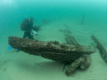 Divers are seen during the discovery of a centuries-old shipwreck, in Cascais in this handout photo released September 24, 2018. Augusto Salgado/Cascais City Hall/Handout via Reuters