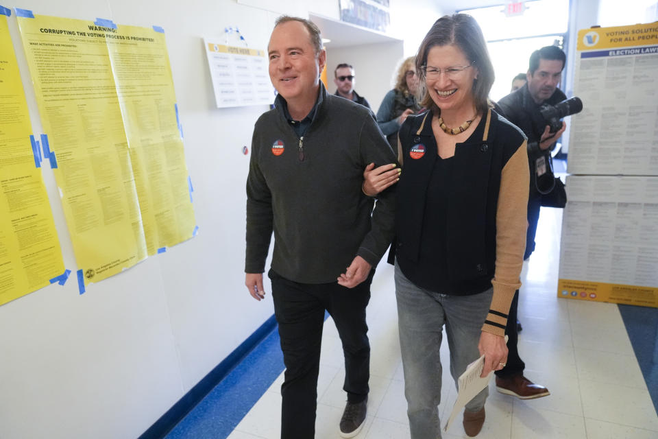 Rep. Adam Schiff, D-Calif., left, walks out of a polling center with his wife Eve after voting, Tuesday, March 5, 2024, in Burbank, Calif. Schiff is running for U.S. Senate to replace the late Sen. Dianne Feinstein. (AP Photo/Marcio Jose Sanchez)