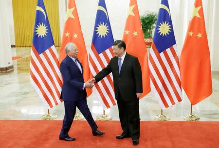 Malaysian Prime Minister Najib Razak meets Chinese President Xi Jinping ahead of the Belt and Road Forum in Beijing, China May 13, 2017. REUTERS/Jason Lee