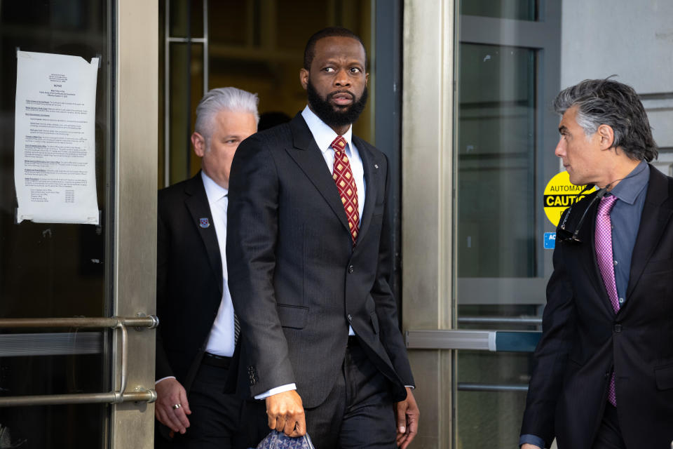 Pras Michel, former member of the Fugees, center, exits federal court in Washington, D.C. on April 3, 2023.  / Credit: Graeme Sloan/Bloomberg via Getty Images