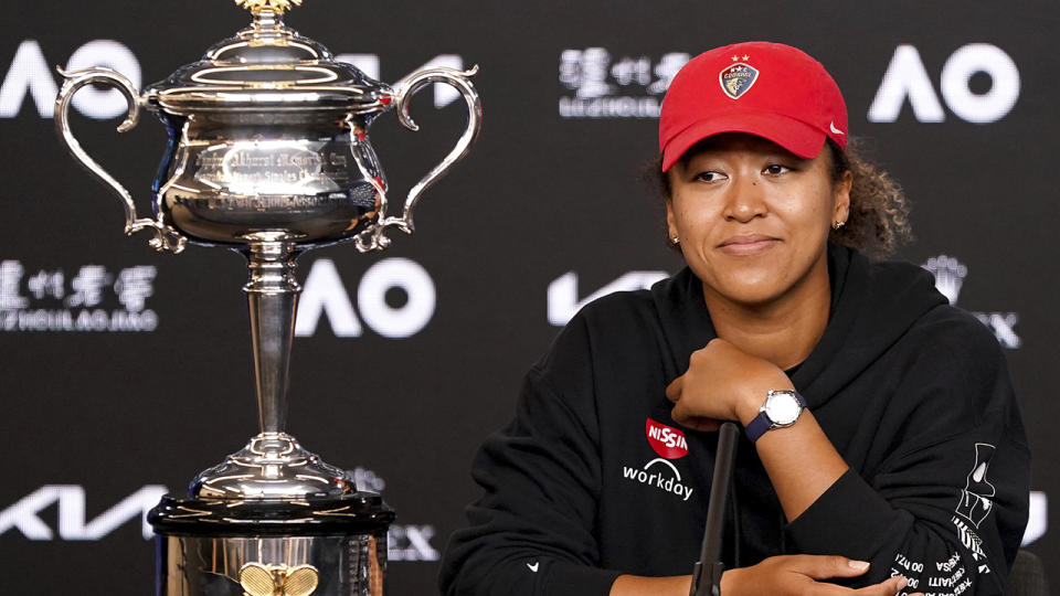 Naomi Osaka, pictured here next to the Daphne Akhurst Memorial Cup at her post-match press conference.