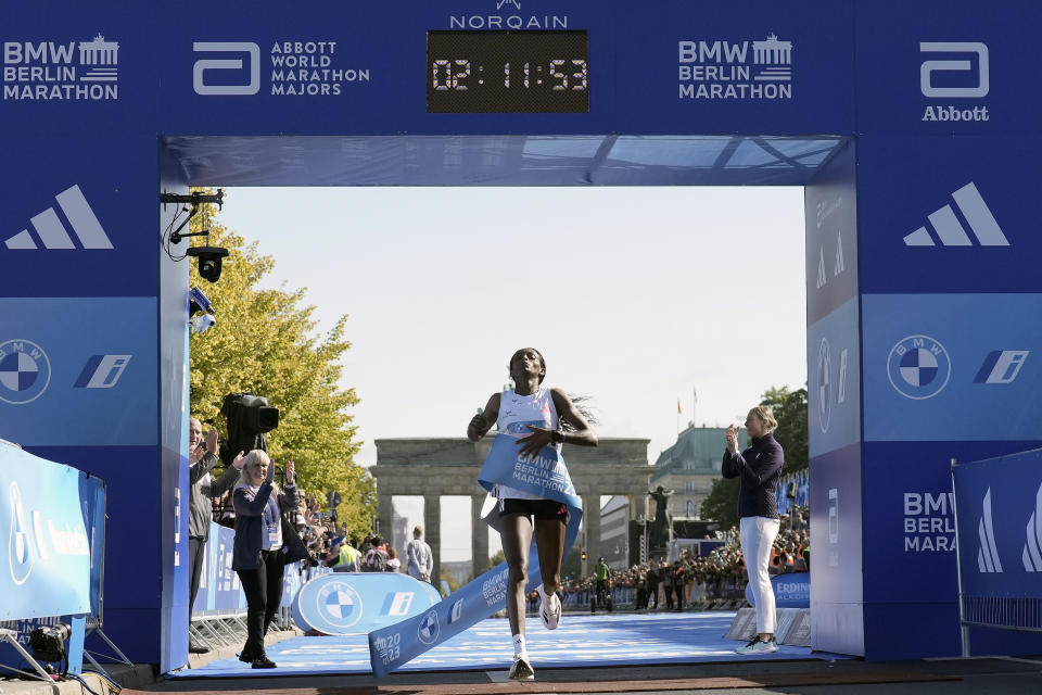 Ethiopia's Tigist Assefa crosses the finish line to win the women's division of the Berlin Marathon in world record time in Berlin, Germany, Sunday, Sept. 24, 2023. (AP Photo/Markus Schreiber)