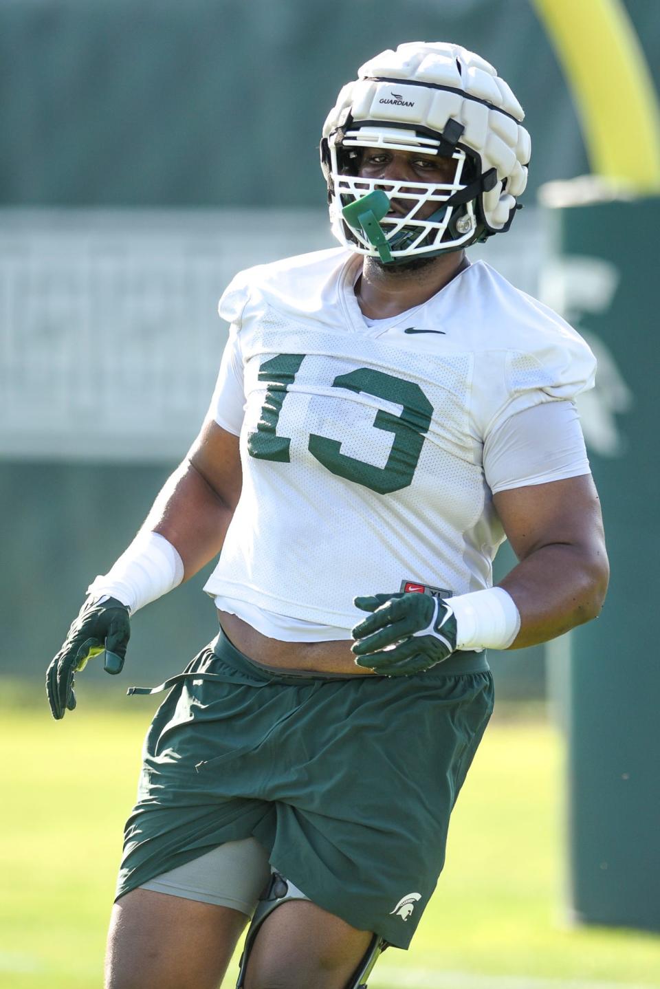 Michigan State defensive lineman Jarrett Jackson runs a drill during the opening day of MSU's football fall camp on Thursday, Aug. 3, 2023, in East Lansing.