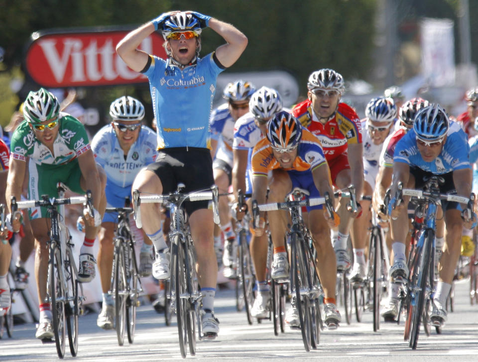 FILE - Mark Cavendish of Great Britain reacts as he crosses the finish line to win the fifth stage of the Tour de France cycling race between Cholet and Chateauroux, central France, Wednesday July 9, 2008. Mark Cavendish broke Eddy Merckx's long-standing record for most career Tour de France stage wins with his 35th victory on Wednesday July 3, 2024. (AP Photo/Christophe Ena, File)