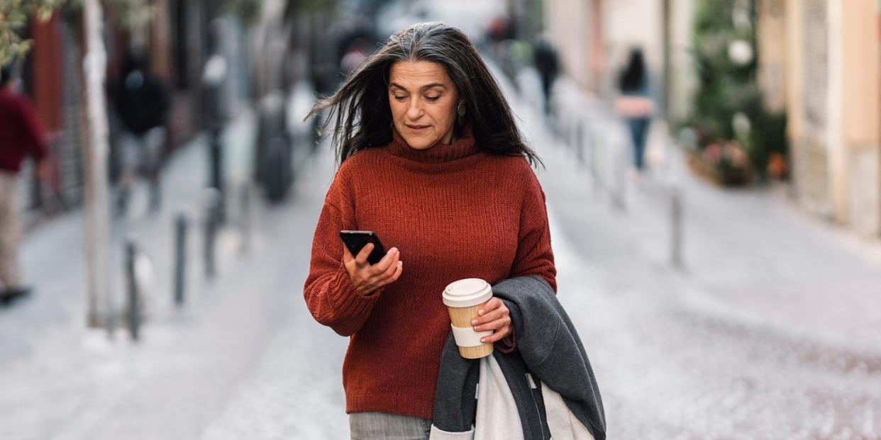 older woman looking at phone- dear google calendar