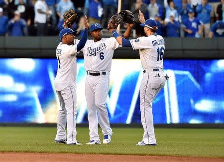 Oct 9, 2015; Kansas City, MO, USA; Kansas City Royals players Jarrod Dyson (1) , Lorenzo Cain (6) and Paulo Orlando (16) celebrate after defeating the Houston Astros in game two of the ALDS at Kauffman Stadium. Mandatory Credit: Peter G. Aiken-USA TODAY Sports