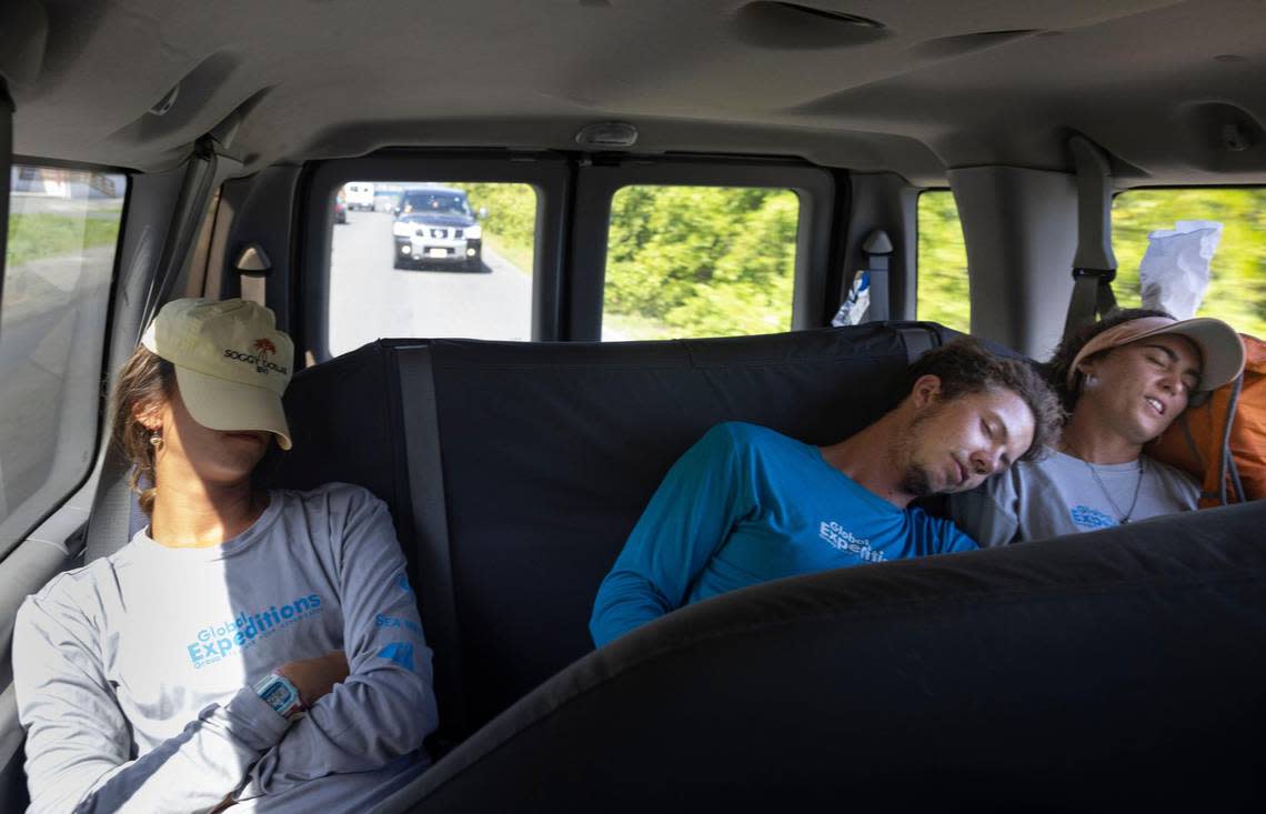 Emma Linberg, left, high school teacher in Aventura, Robbie McKellar, center, and Inês Schwartz rest in the taxi on the way back to the dock after dropping some boats back off to the boat charter company on Wednesday, July 27, 2022 in the British Virgin Islands.