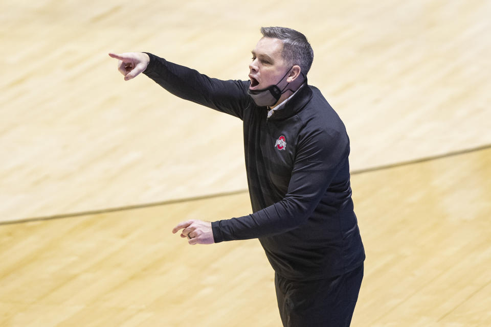 Ohio State head coach Chris Holtmann directs players during the second half of a first-round game against Oral Roberts in the NCAA men's college basketball tournament, Friday, March 19, 2021, at Mackey Arena in West Lafayette, Ind. Oral Roberts won in overtime. (AP Photo/Robert Franklin)