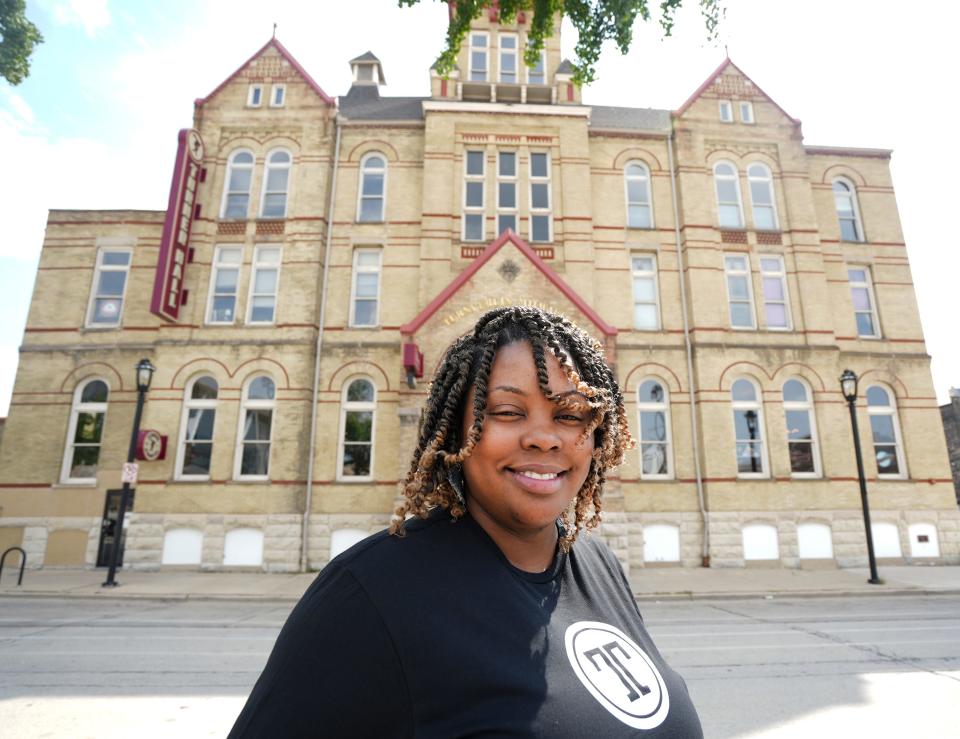 Emerald Mills, owner, poses Aug. 19 outside Turning Tables, located at the historic Turner Hall in downtown Milwaukee. "Changing the narrative around Black-owned restaurants and their success rates is going to be exciting," she says. Turning Tables combines a restaurant operation into incubator kitchen.