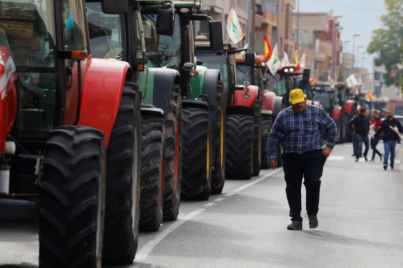 Tractors block a street during a protest of Spanish farmers and ranchers against low tariffs and distribution costs in the agriculture sector in Murcia