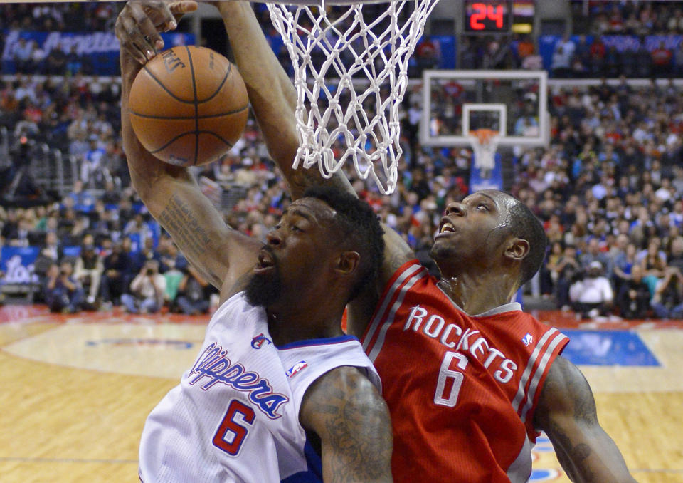 Los Angeles Clippers center DeAndre Jordan, left, and Houston Rockets forward Terrence Jones battle for a rebound during the first half of an NBA basketball game, Wednesday, Feb. 26, 2014, in Los Angeles. (AP Photo/Mark J. Terrill)