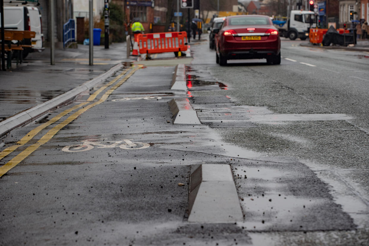 Cyclists are separated from cars by a series of raised blocks that lie in a crooked line. (SWNS)