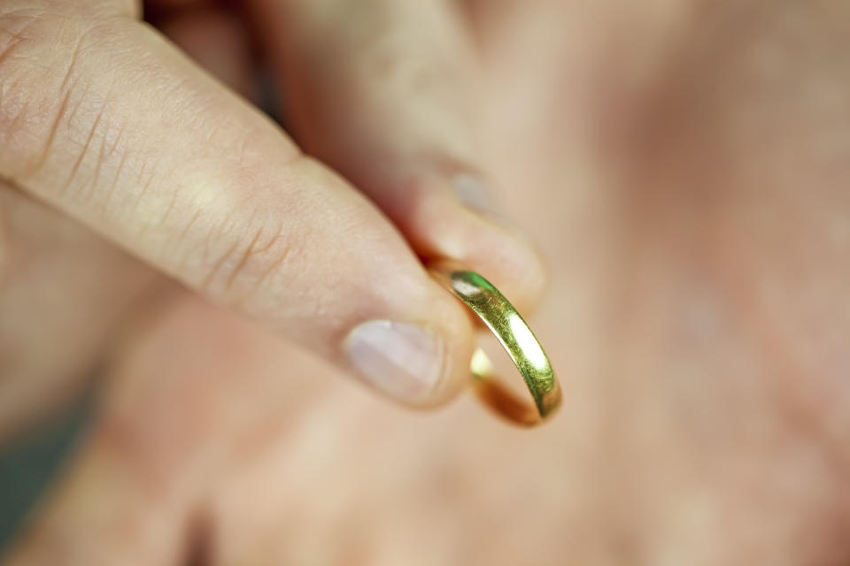 A man holding old wedding ring