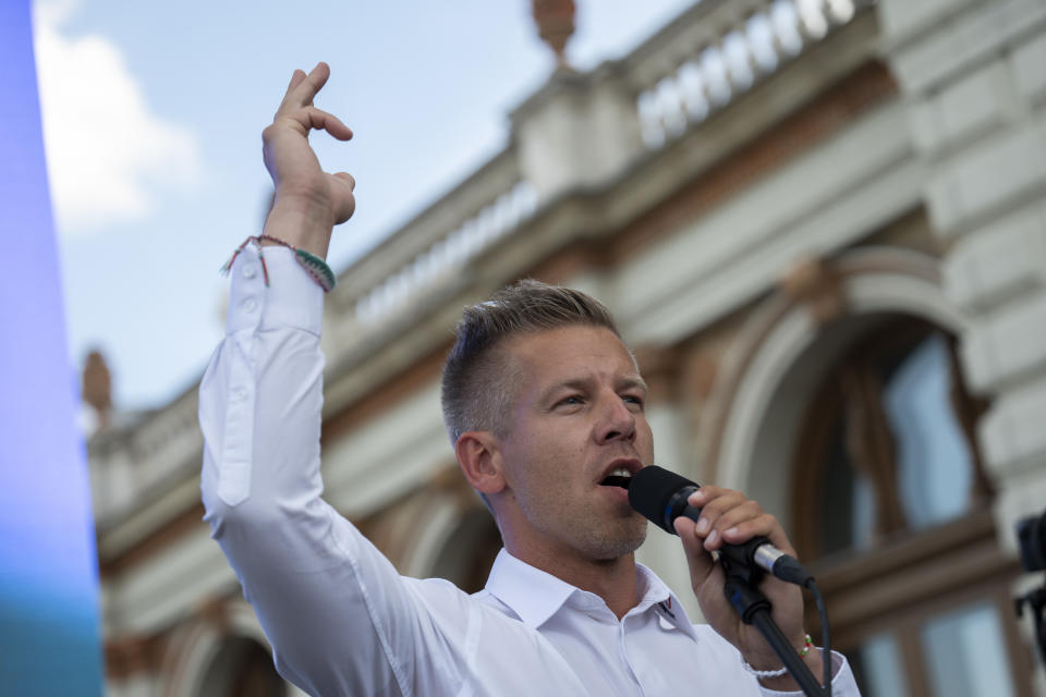 Peter Magyar speaks at a protest in Budapest, Thursday May 30, 2024, before his pitch at the debate stage ahead of the European Parliament elections, The debate, where the leaders of 11 party lists running in the June 9 elections, is the first to be broadcast by Hungary's public media since 2006, while protesters outside demonstrated against the public broadcaster that is hosting the event. (AP Photo/Denes Erdos)