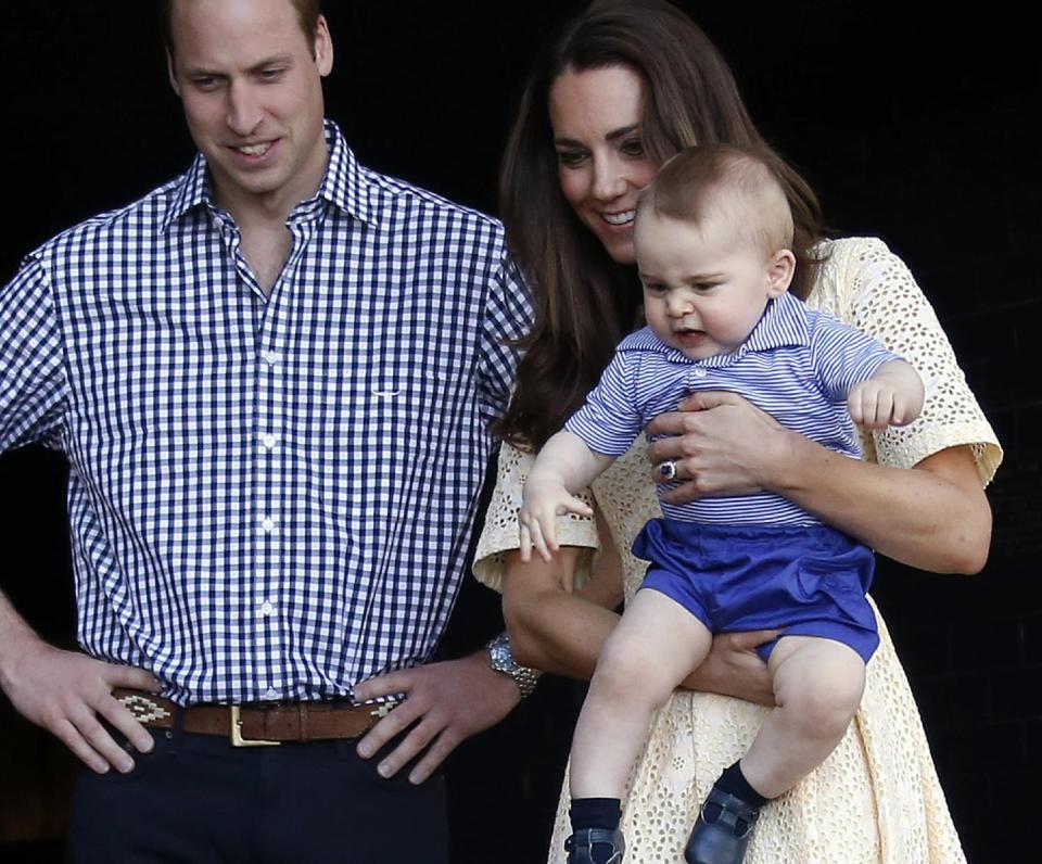 Britain's Kate, the Duchess of Cambridge, and her husband Prince William watch as their son Prince George looks at an Australian animal called a Bilby, which has been named after the young prince, during a visit to Sydney's Taronga Zoo, Australia Sunday, April 20, 2014. (AP Photo/David Gray, Pool)