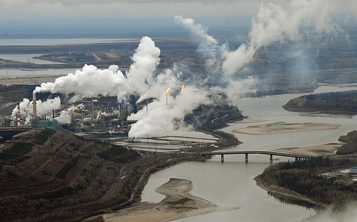 Aerial view of the Suncor oil sands extraction facility on the banks of the Athabasca River and near the town of Fort McMurray in Alberta, Canada  (AFP via Getty Images)